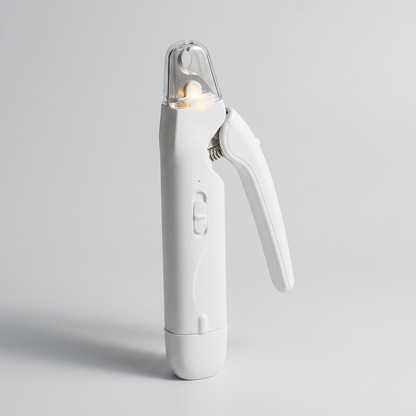 LumaClip Pro white dog nail clipper with the LED switched on